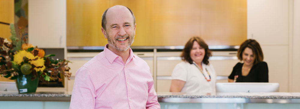 Dr Roper and staff at the front desk